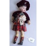 An Antique German Herm Steiner porcelain-headed doll, with jointed wooden limbs, 11"