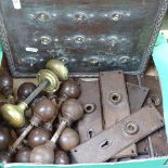 Brass and Bakelite door knobs, finger plates, and a light-switch panel