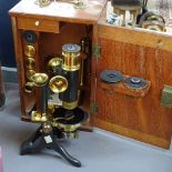 A mahogany-cased brass-mounted student's microscope and accessories, case height 11.75"