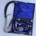 An ophthalmoscope and a stethoscope, both by Bailey of London