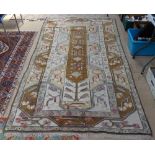 A cream and brown ground Persian style rug, 150cm x 137cm