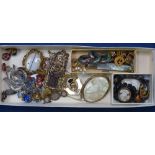 A tray of Vintage and other costume jewellery, to include marcasite brooches, a silver-gilt framed