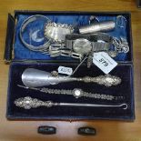 A group of silver items, to include silver-handled shoe horn and button-hook, cased, bangle,