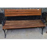 A wrought-iron and slatted hardwood garden bench, L123cm