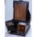 A Chinese brass-bound hardwood travel chest, with drawer fitted interior and fold-out mirror, height