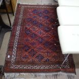 A red ground Turkish rug with symmetrical pattern and border, 165cm x 109cm