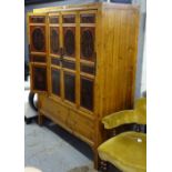 A large Chinese cabinet, having 4 red and black lacquered panelled doors, and a shelf fitted