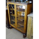 A 1920s oak bookcase with 2 glazed doors, W88cm