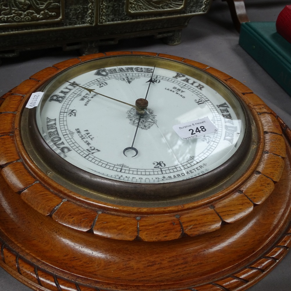 A carved oak-cased aneroid barometer, diameter 13" - Image 2 of 2