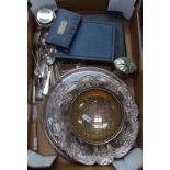 A box containing silver plated rose bowl, serving trays, cutlery etc