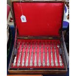 A cased set of silver plated dessert knives and forks for 12 people