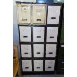 A bank of 12 industrial metal filing drawers, W73cm, H147cm