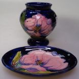 A Moorcroft vase with tube lined pink flowers, height 3.5", and a Moorcroft dish