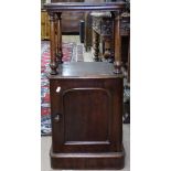 A Victorian mahogany bedside cupboard with panelled door, W36cm