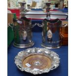 A pair of Victorian silver plate on copper candlesticks, an embossed silver plated wine coaster, and