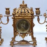 An ornate 19th century gilt-bronze cased 3-piece clock garniture, with engraved brass dial and 8-day