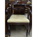A George III mahogany desk chair on turned legs
