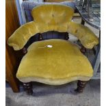 A Victorian button-back upholstered bow-arm chair