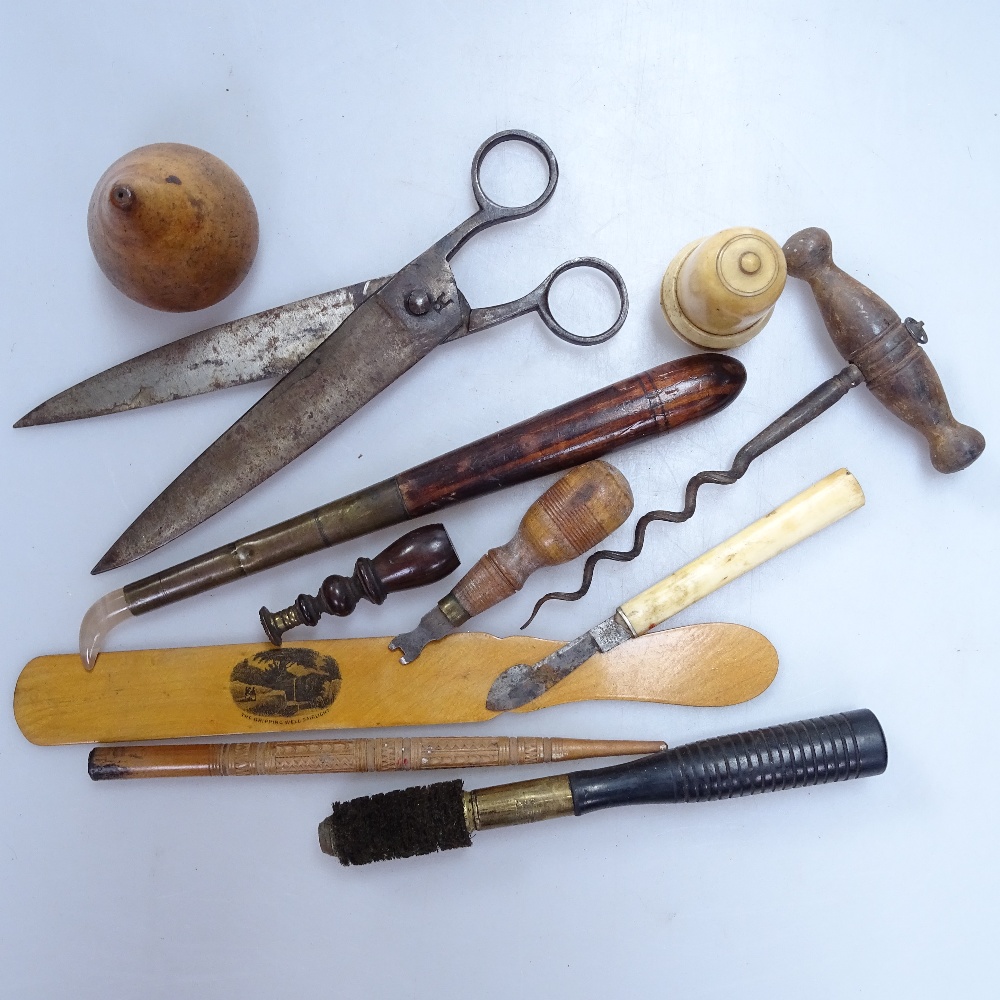 A 19th century gilder's tool with agate tip, corkscrew, bone weighted bell pull, paper knife, shears