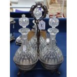 An Elkington & Co silver plated 3-section decanter stand, together with 3 cut-glass decanters