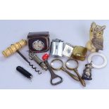 Brass magnifiers, a lighter, a bone-handled corkscrew, a rattle etc