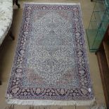 A blue ground Persian design rug, 155cm x 92cm