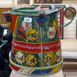 A bargeware watering can with painted floral decoration