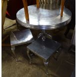 A brushed aluminium circular table on tripod base, and a pair of matching stools
