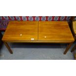 A.H. McIntosh & Company Limited, a rectangular teak coffee table, with sliding top, W107cm, label to