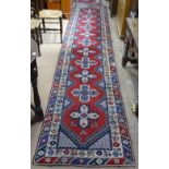 A red ground Turkish runner, with 2 borders and symmetrical pattern, and a similar small mat, runner
