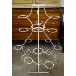 A painted wrought-iron 15-section plant stand, H102cm