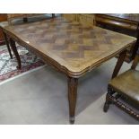 A French parquetry-topped oak draw leaf dining table, L150cm