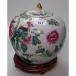 Chinese jar and cover with enamelled floral design, height 7.5", on fitted wooden stand