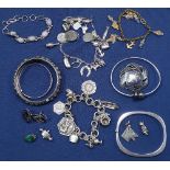 A quantity of silver charm bracelets, bangles, sterling silver and niello jewellery etc