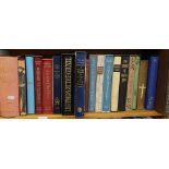 A shelf of folio books, including Kenneth Clark, Marco Polo, and Legends of the Grail