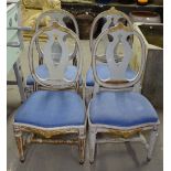 A set of 4 painted chairs with upholstered drop-in seats, on fluted legs