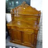 A Victorian mahogany serpentine-front chiffoniere, with raised panel back and drawer and cupboards