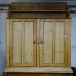 A polished pine hanging 2-door cabinet, W107cm