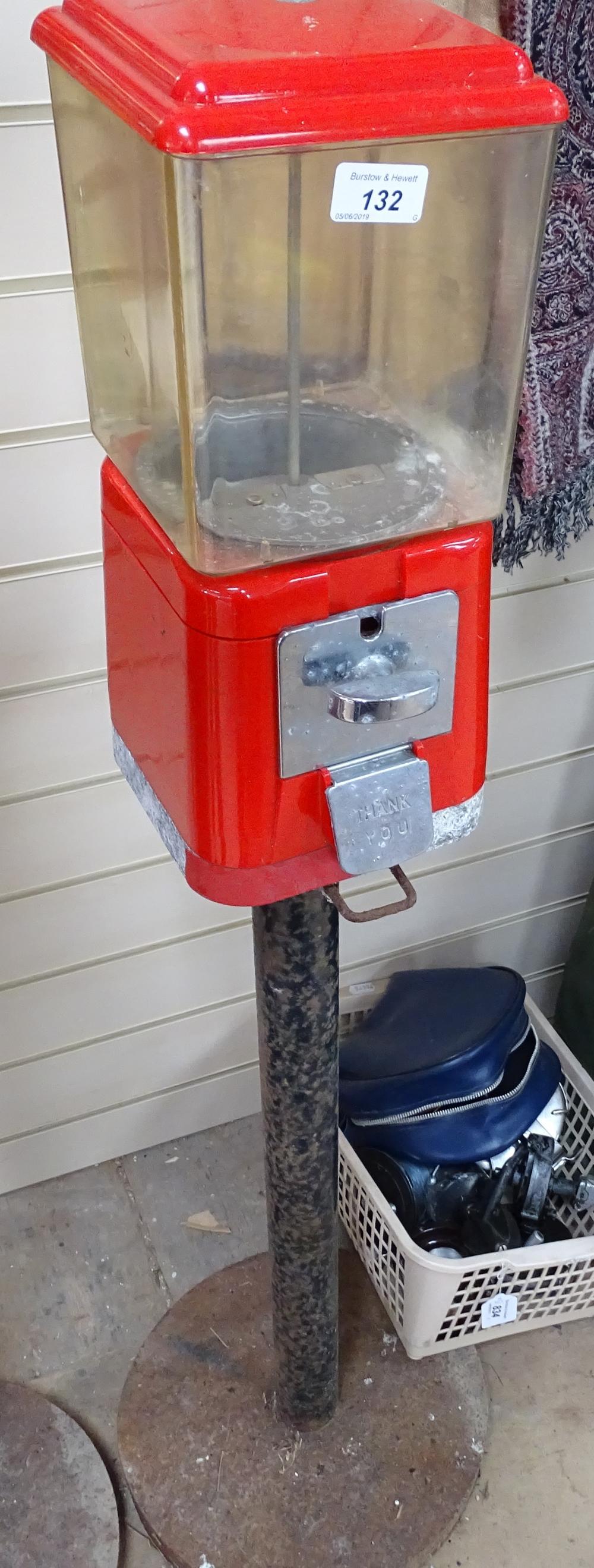 A Vintage red plastic bubblegum dispensing machine, on cast-iron stand, height 54.5" - Image 2 of 2