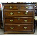 An 18th century joined oak chest, with 2 short and 3 long drawers, having moulded edge, raised on