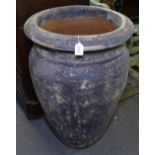 A large textured terracotta garden pot, H84cm