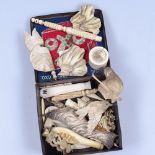 An OXO tin containing ivory boxes and pieces and bone items