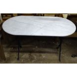 A white and grey veined oval marble-top garden table on metal base, W118cm