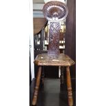 An Antique carved oak spinning stool