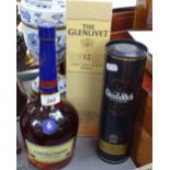A litre bottle of Courvoisier, a boxed bottle of 12 year old Glenfiddich Whisky, and another of