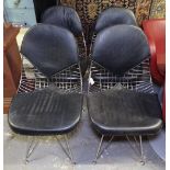 A set of 4 Eames style DKR Bikini chairs with black leather covers