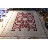 A cream ground wool rug with floral pattern, 300cm x 200cm