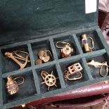 A box containing 8 nautical themed brass keyrings