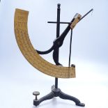 A paper scale on cast-brass stand, by H E Messmer, London, height 15"