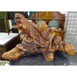 A root carved study of prowling tigers, W95cm